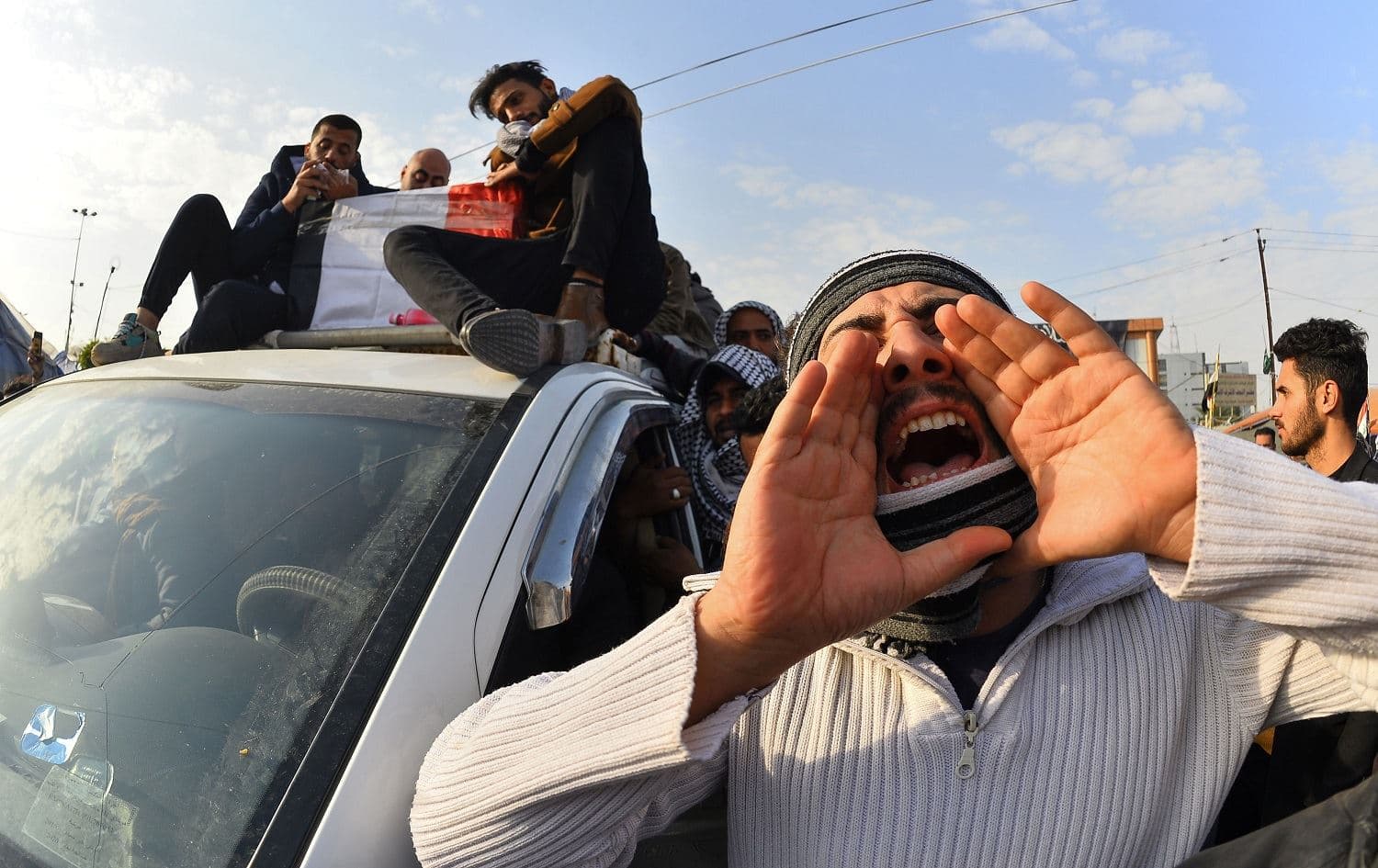  Mourners attend the funeral of Thaer al-Tayeb, a prominent activist killed in suspicious explosion on December 15, in the centre of the holy shrine city of Najaf on December 25, 2019. Photo: Haidar Hamdani/AFP