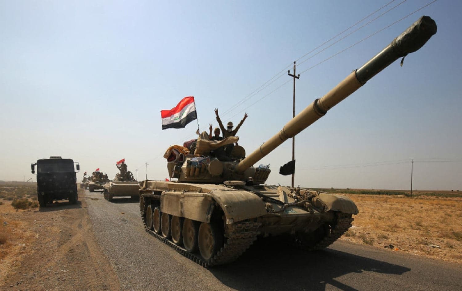 Iraqi forces drive Kurdish peshmerga forces on October 15, 2017 on southern outskirts of Kirkuk. Photo: Ahmed al-Rubaye/AFP