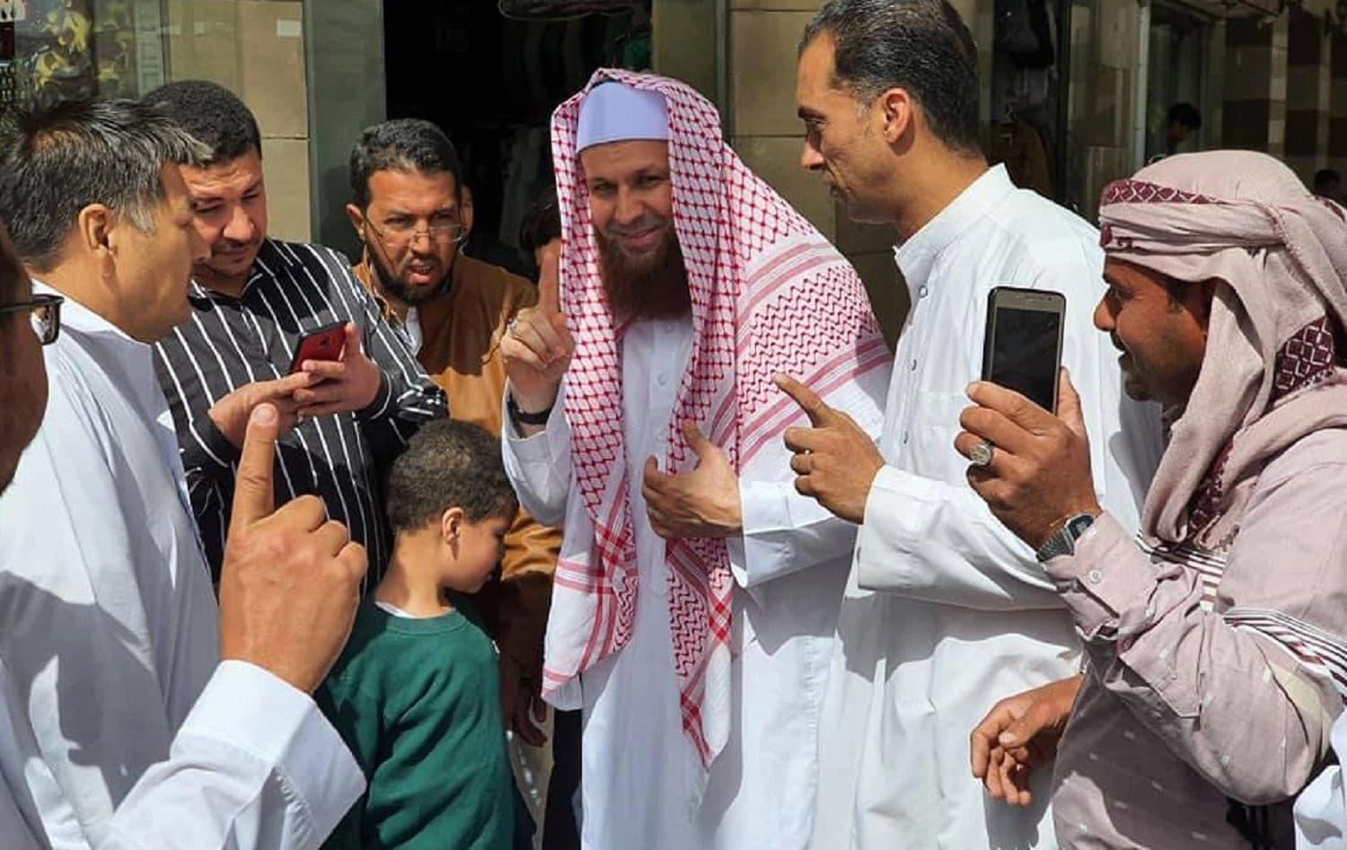 Mullah Ali Kalak (center), more widely known as Mala Ali Kurdistani, poses in a photo posted to his official Facebook page on February 13, 2020. 