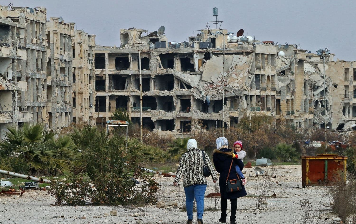 Residents of a neighbourhood on the edge of the northern Syrian city of Aleppo return to their homes to check the damage caused by fighting between regime forces and rebel fighters, February 18, 2020. Photo: AFP