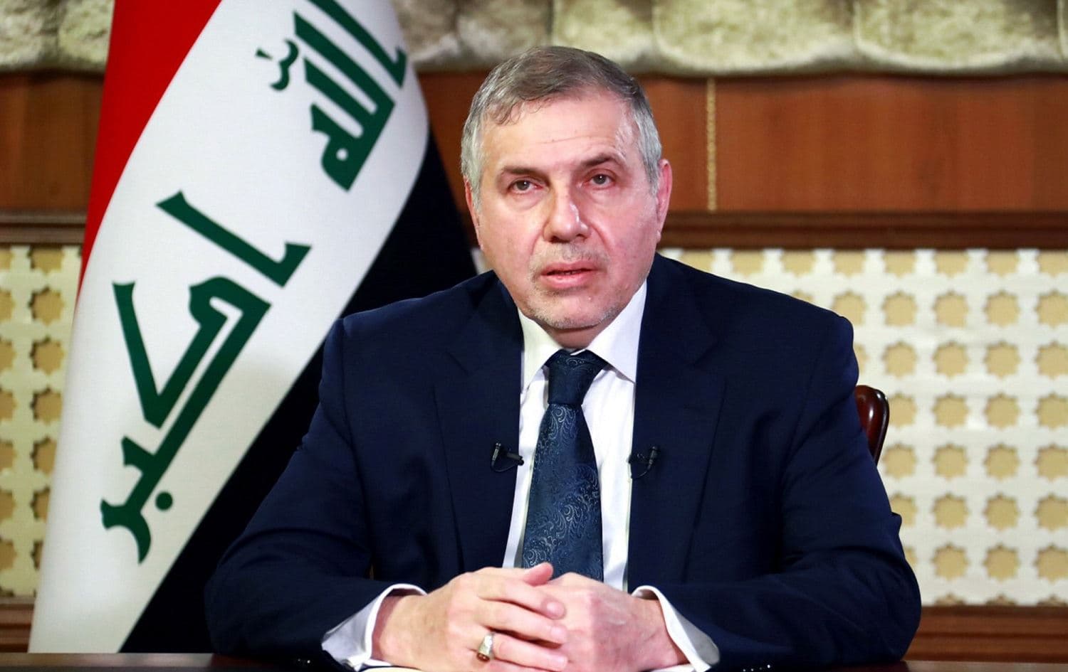 A handout picture released by Iraqi Prime Minister's Media Office shows Iraqi prime minister-designate Mohammed Tawfiq Allawi giving a televised speech in Baghdad on February 19, 2020. Photo: Iraqi Prime Minister's Press Office / AFP 
