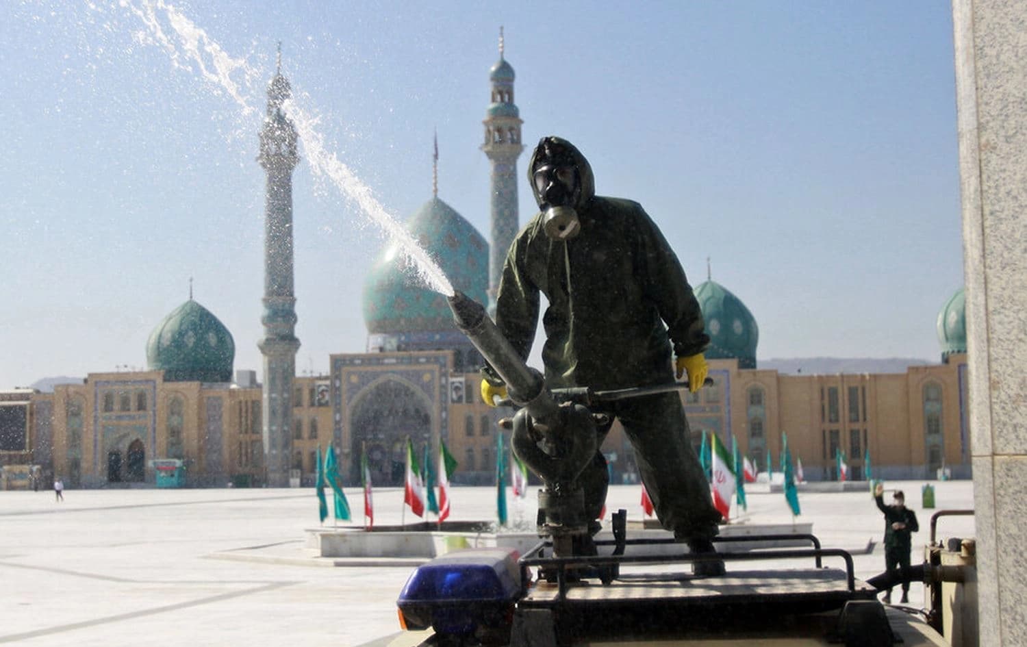 Iranian soldiers and Revolutionary Guards spray Qom’s religious sites with disinfectant, March 5, 2020. Photo: ISNA
