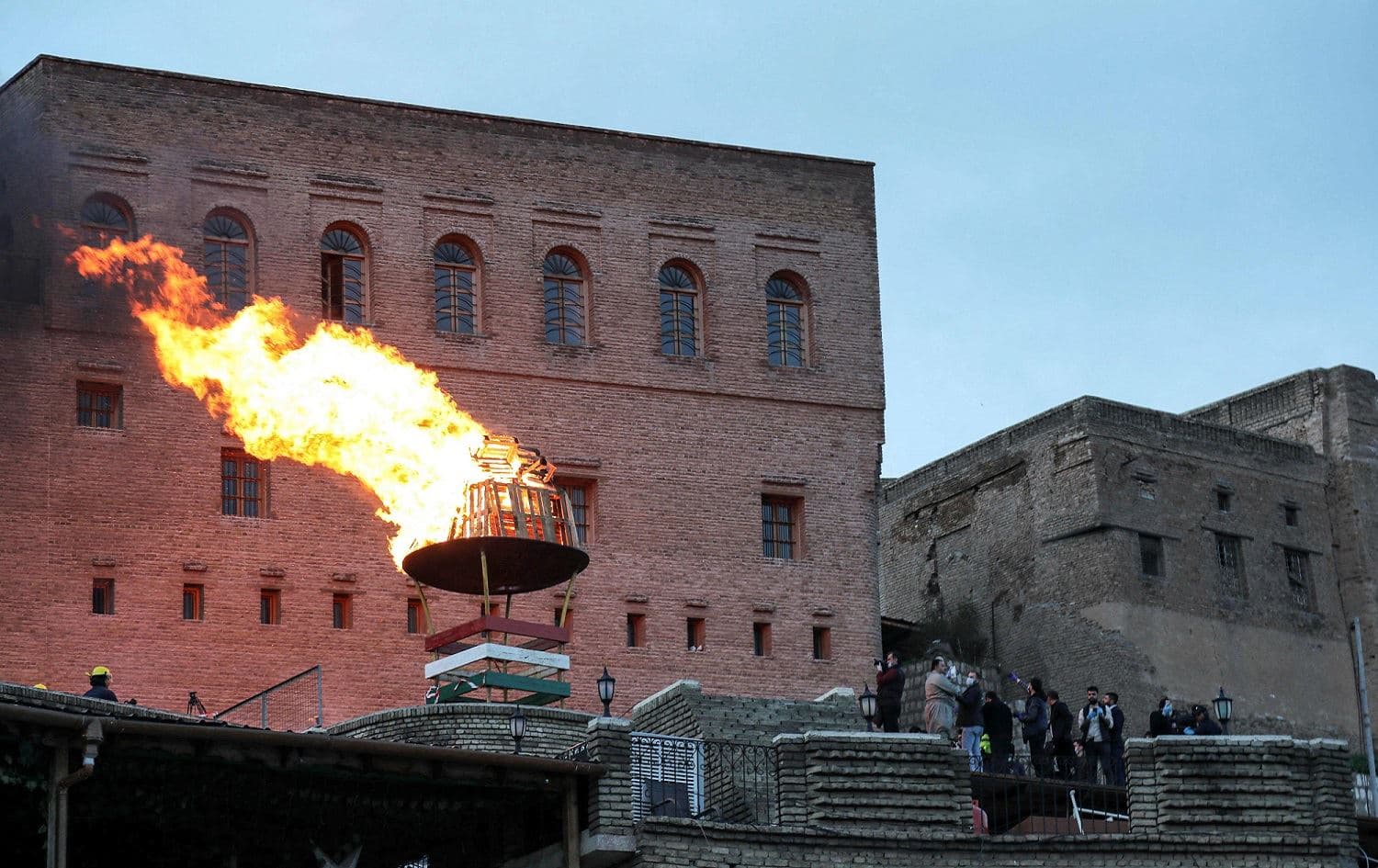 Kurds light a Newroz fire at the Erbil citadel, March 20, 2020. Photo: Safin Hamed / AFP 