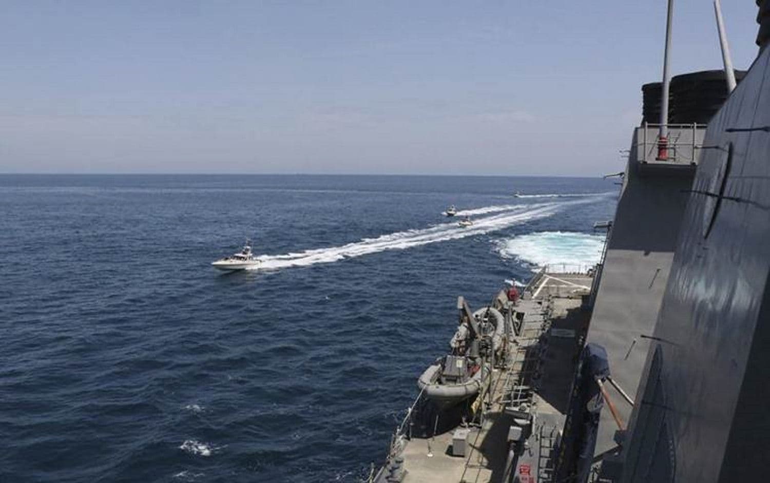 In this Wednesday, April 15, 2020, photo made available by U.S. Navy, Iranian Revolutionary Guard vessels sail close to US military ships in the Persian Gulf near Kuwait. Photo: US navy via AFP