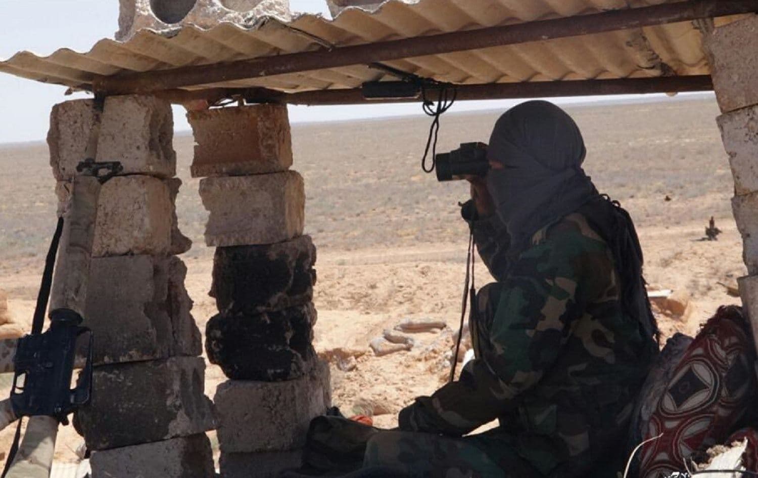 Image from an ISIS mouthpiece Telegram channel purportedly showing a group militant in action in Homs province, Syria in Ramadan of this year (April-May 2020).