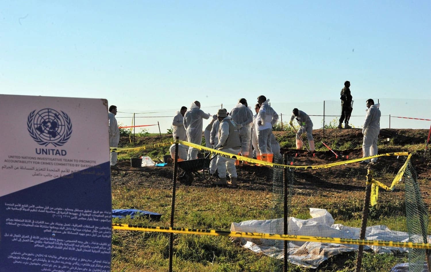 UNITAD workers exhume the remains of Yezidis killed by the Islamic State group (ISIS) in Kojo, Shingal, northern Iraq, March 17, 2019. File photo: UNITAD Iraq