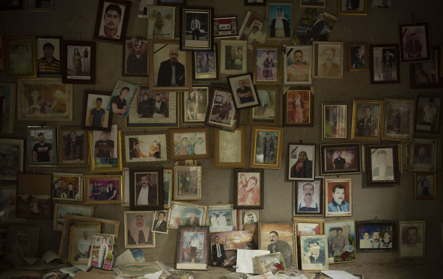 Pictures of Yezidis slain in 2014 by Islamic State militants are found in a small room at the Lalish shrine. Photo:Maya Alleruzzo / AP