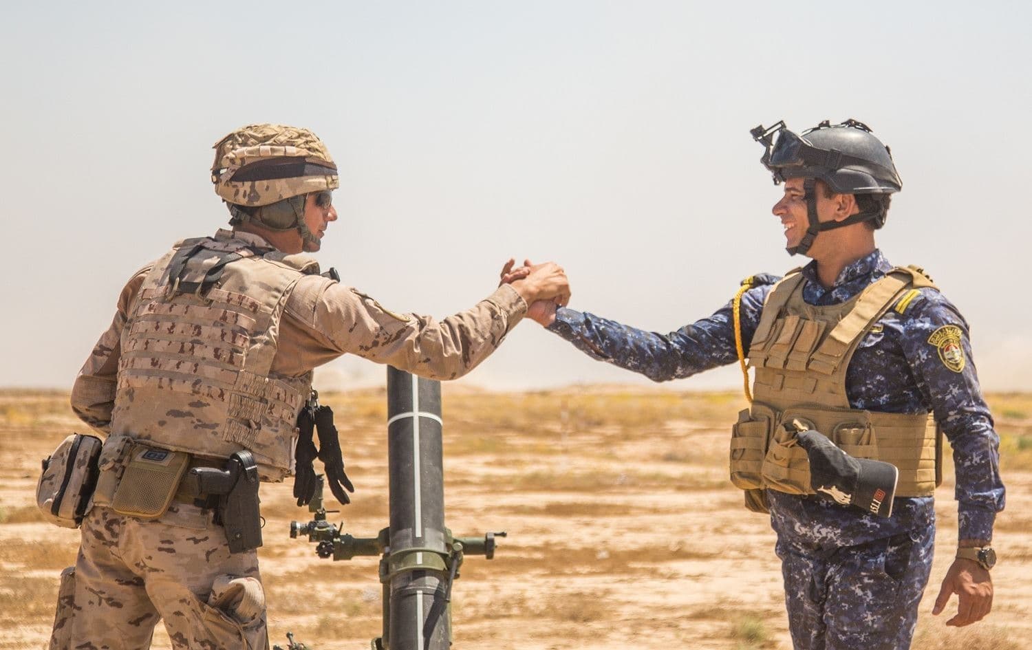 A Spanish soldier mentors a member of Iraq's security forces at Besmaya Range complex on June 12, 2019. Photo: Brandon Best/US Army