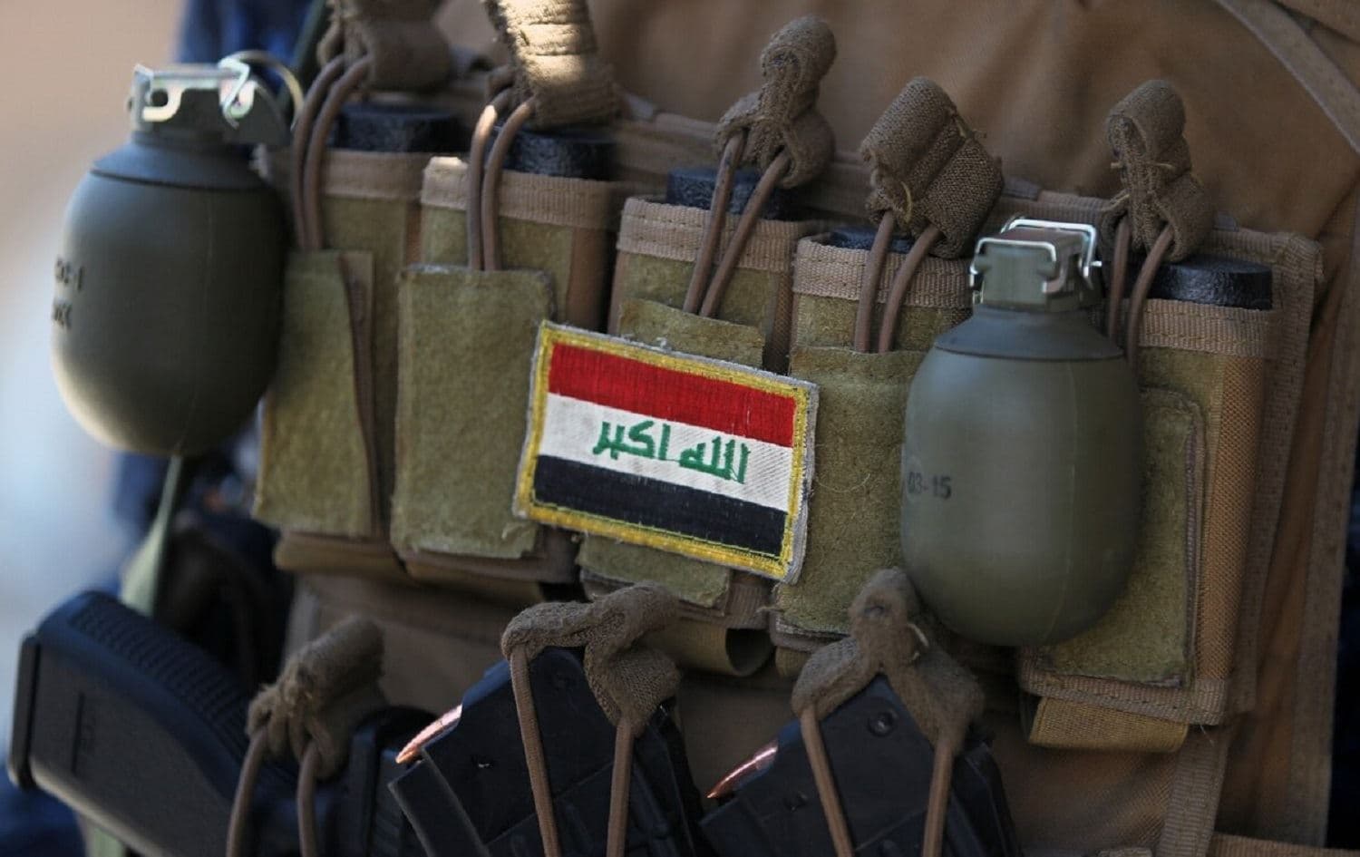 An Iraqi flag patched on the ammunition belt of a member of the Iraqi forces is seen June 19, 2017, during an offensive to retake the last district still held by the Islamic State group fighters in Mosul. Photo: Ahmad al-Rubaye / AFP via Getty Images