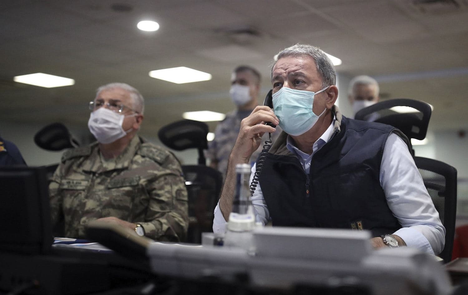 Turkish Defense Minister Hulusi Akar monitors operations at a military headquarters in Ankara in June. File photo: Turkish Defense Ministry/AP