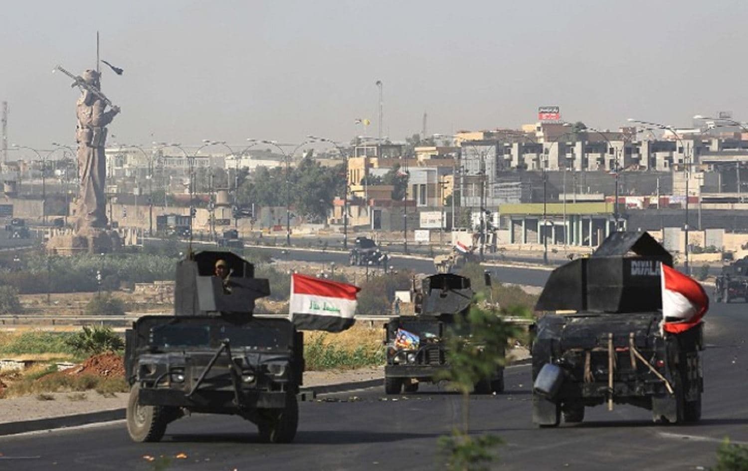 Iraqi military vehicles move through Kirkuk province. Photo: AFP