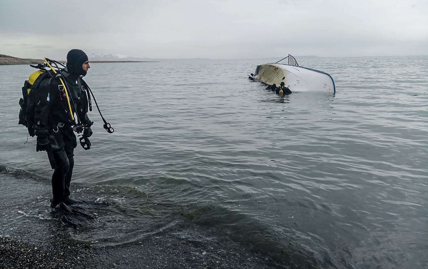 A rescue diver stands on the shores of Lake Van on December 26, 2019 after a boat carrying refugees and migrants sank, killing seven migrants. File photo: DHA / AFP