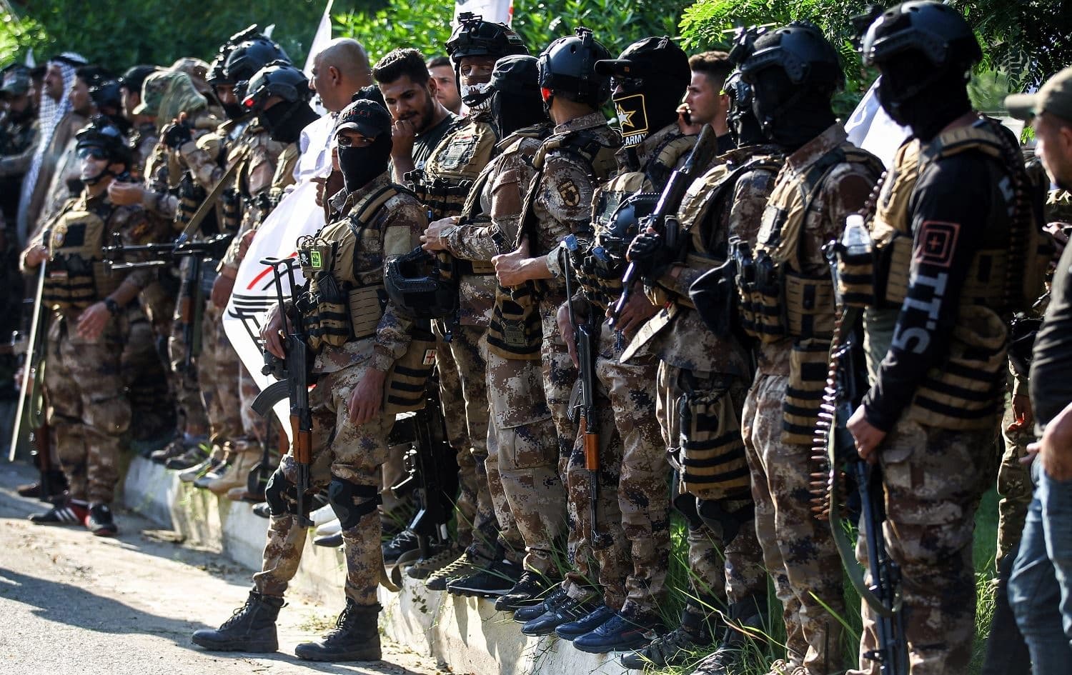 Members of PMF paramilitiaries stand guard during the funreal for Asaib Ahl al-Haq commander Wissam Alyawi in Baghdad on October 26, 2019. File photo: Ahmad al-Rubaye/AFP