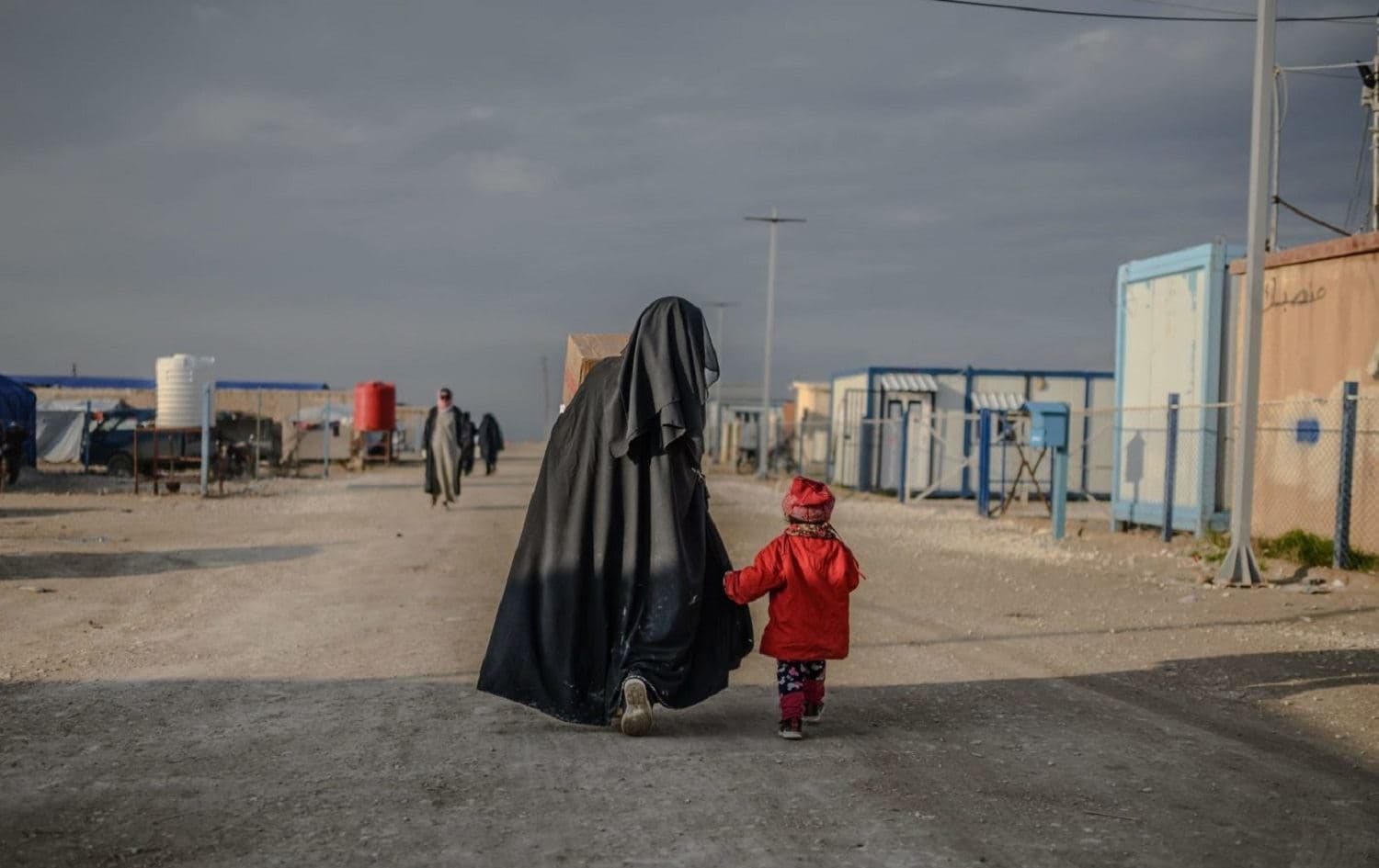 A woman and child walk in al-Hol camp in northeastern Syria on February 17, 2019. File photo: Bulent Kilic/AFP