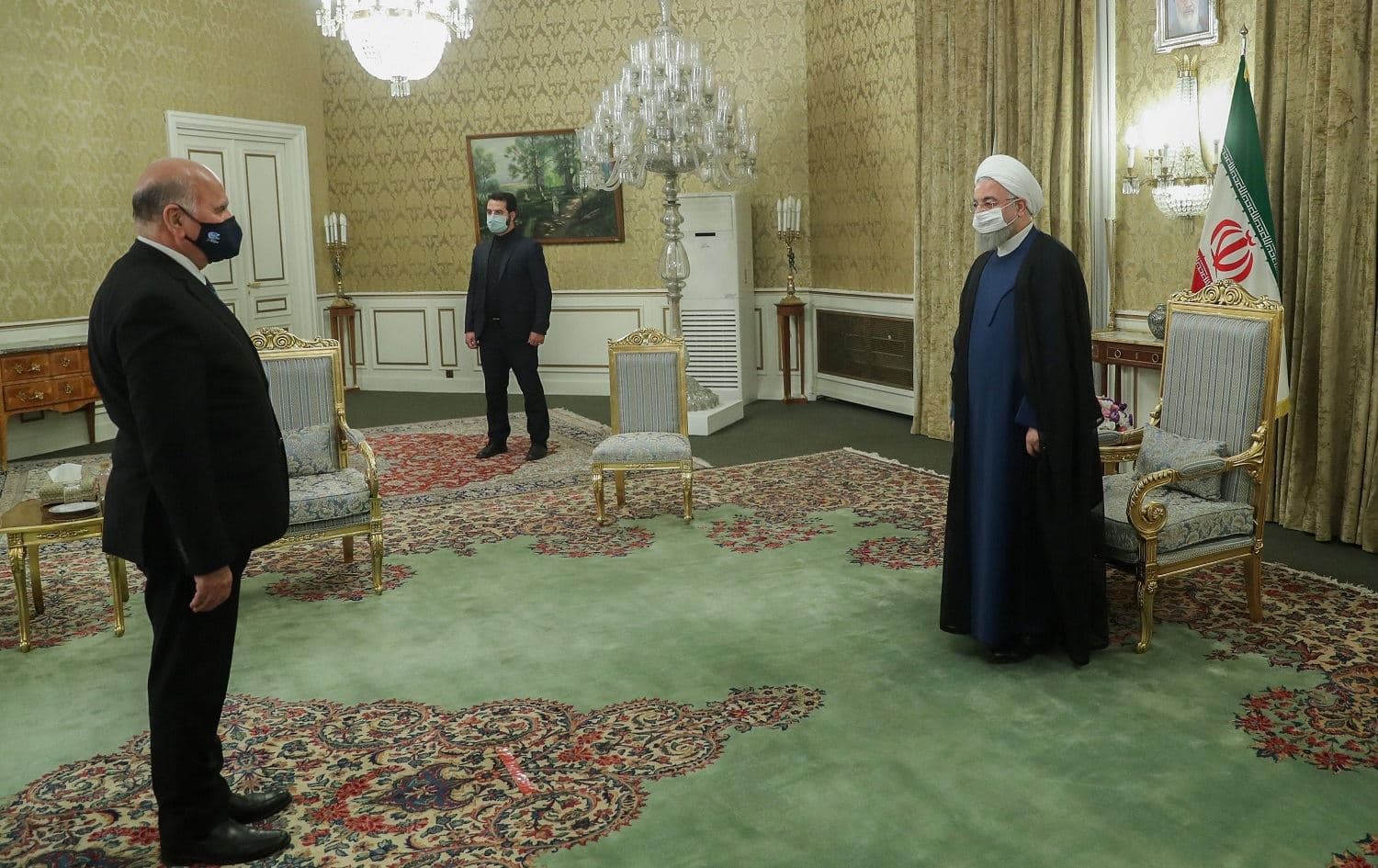 Iranian President Hassan Rouhani (R) welcomes Iraqi Foreign Minister Fuad Hussein (L) in Tehran on September 26, 2020. Photo: Iranian presidency/handout/AFP