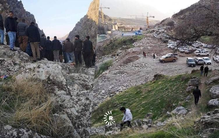 People gather near Deraluk, Duhok province on December 12, 2020, waiting for the recovery of the bodies of three men killed in a suspected Turkish bombardment in the mountains. Photo: submitted to Rudaw by Samie Nerwayi