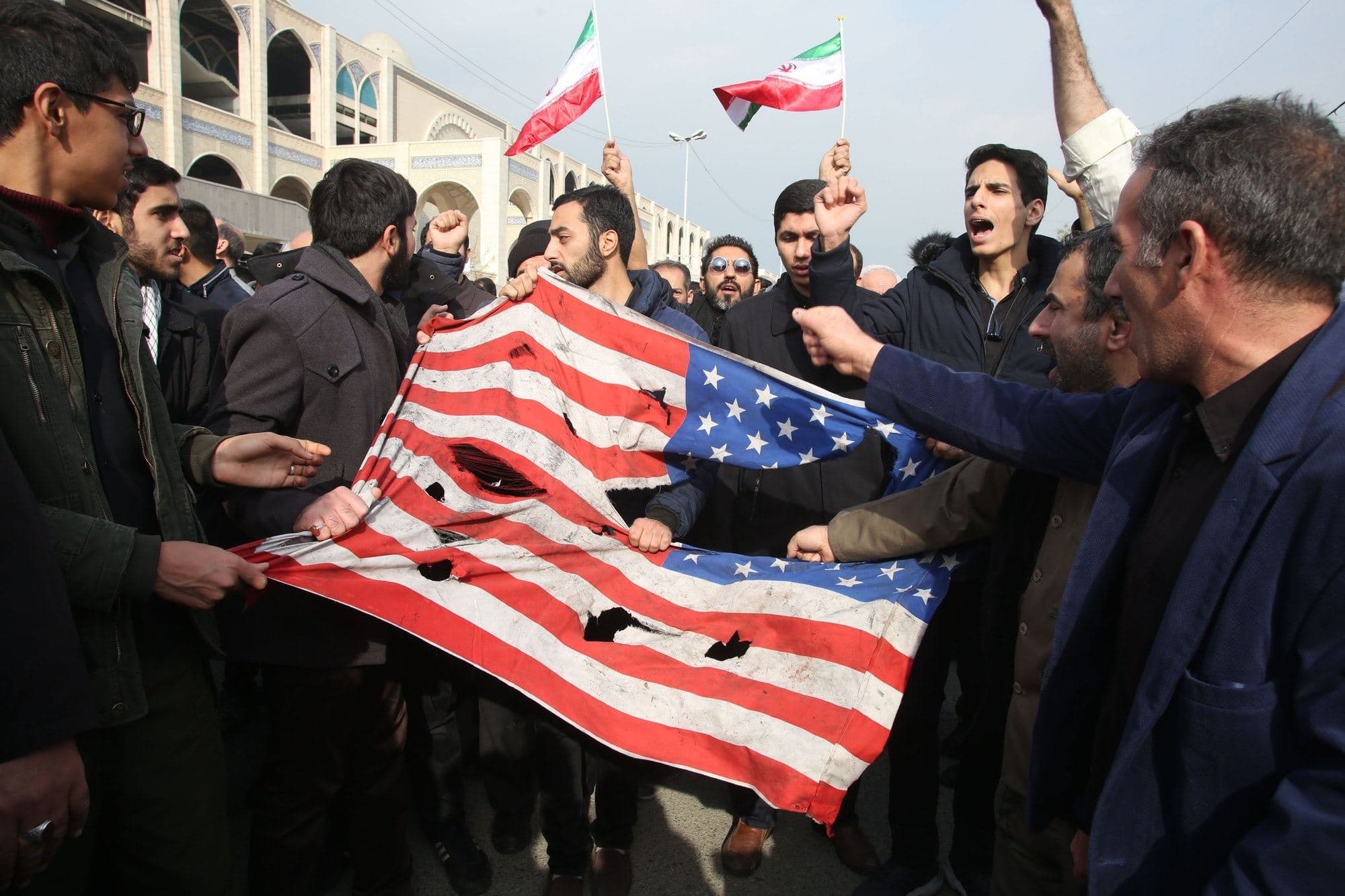 Iranians tear up an American flag in Tehran following the killing of senior Iranian general Qasem Soleimani. File photo: Atta Kenare / AFP