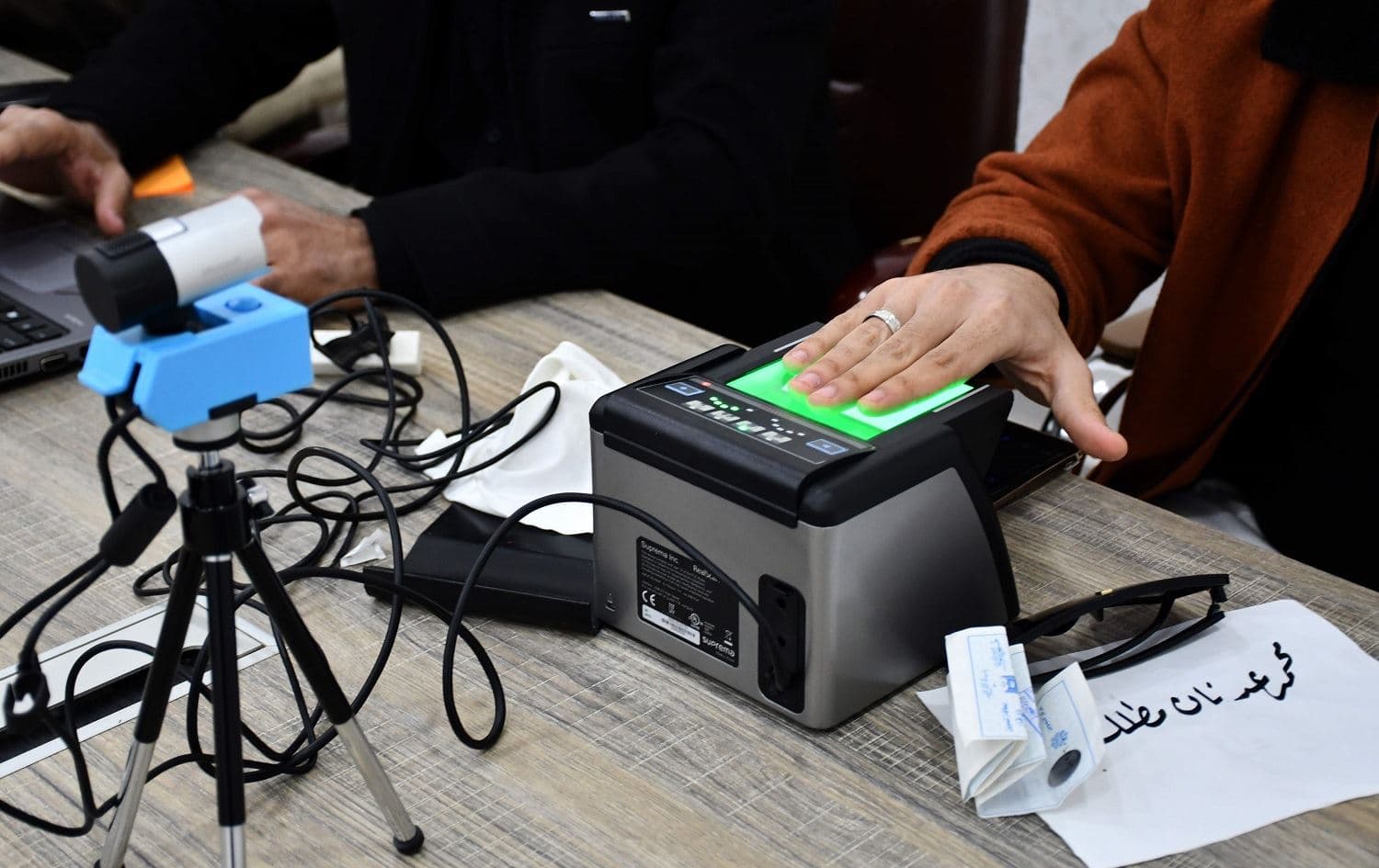 An Iraqi woman updates her voter registration at the Independent High Electoral Commission Center in Nasiriyah on January 12, 2021. Photo: Asaad Niazi/AFP