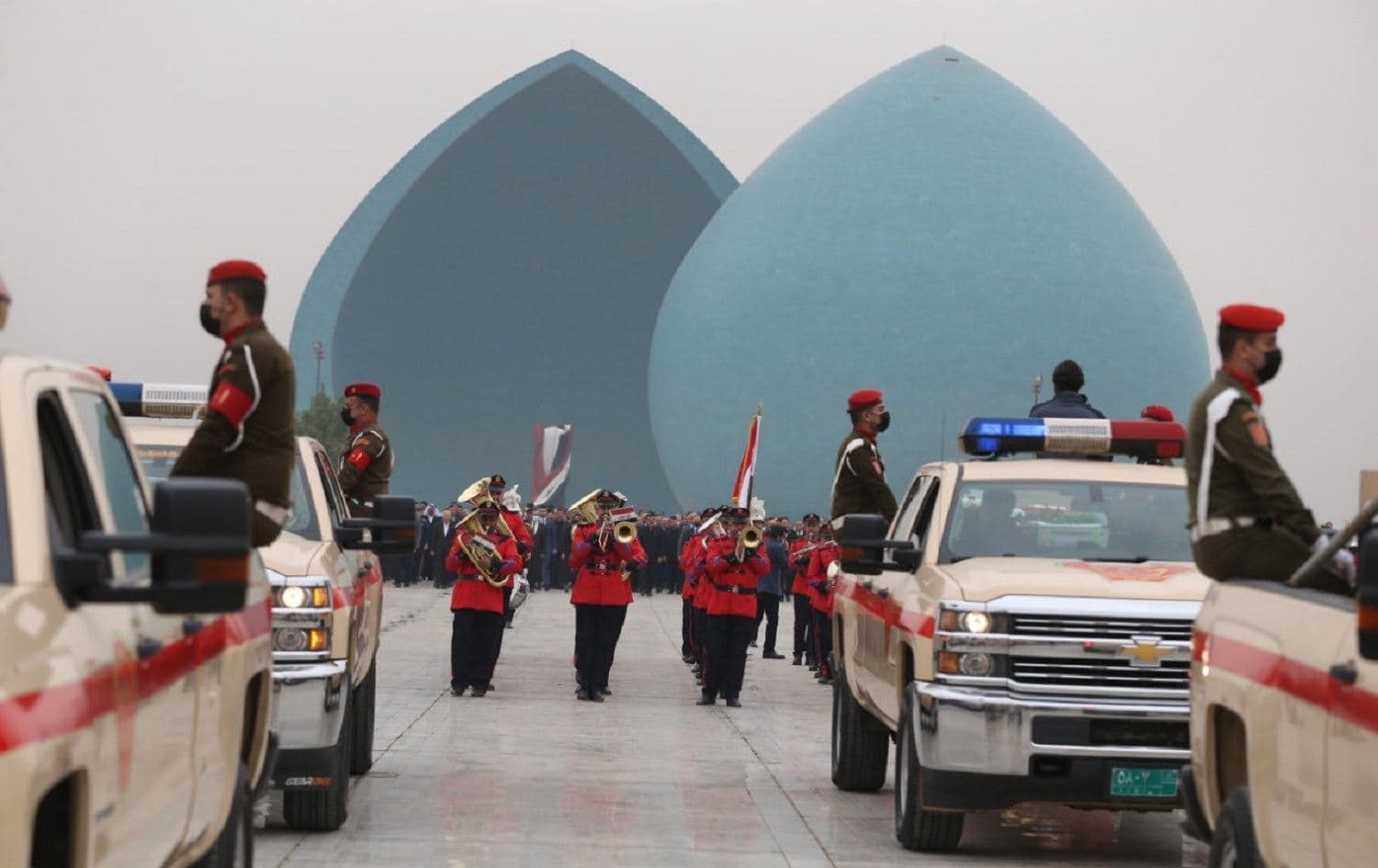 Iraqi officials attended a funeral procession at Baghdad’s Martyr's Memorial Square on February 4, 2021 for 104 Yazidis killed by ISIS in Shingal. Photo: handout/Iraqi presidency
