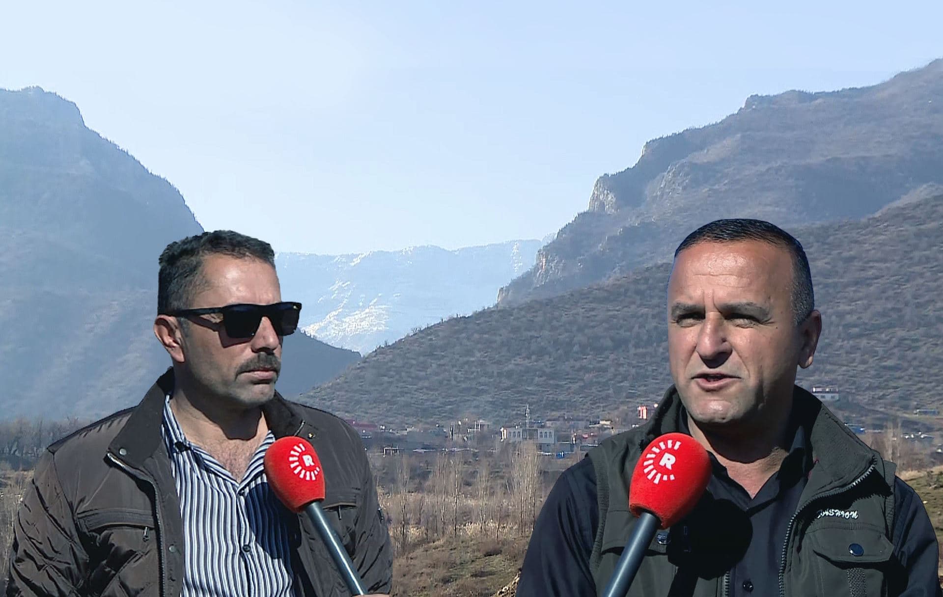 Images of Duhok farmers Ahmed Abdullah (left) and Jambali Omar (right) speaking to Rudaw overlay an image of Mount Gara and a nearby village seen from afar on February 12, 2012. Photos: Rudaw; Graphic: Sarkawt Mohammed/Rudaw