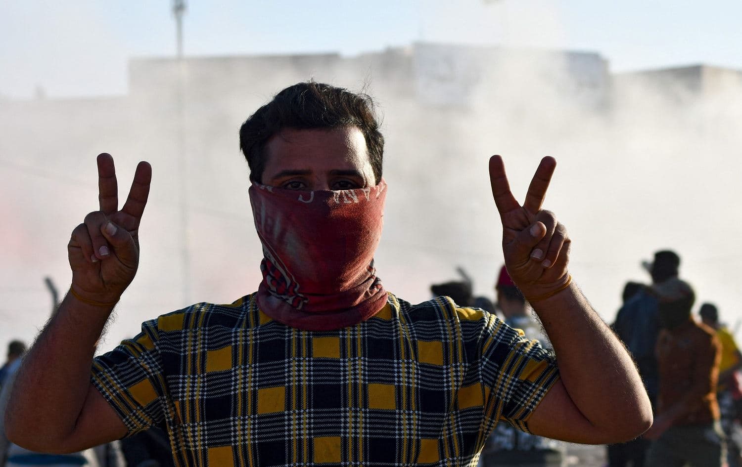 A protester gestures during a demonstration in front of the Dhi Qar Municipal council in Nasiriyah on February 27, 2021. Photo: Assaad al-Nizayi/ AFP