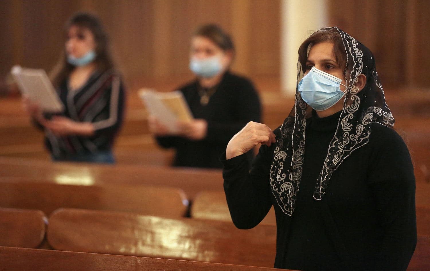 Iraqi Christian women attend mass at St. Joseph Church in central Baghdad on March 10, 2021, following the visit of Pope Francis to Iraq. Photo: Ahmad al-Rubaye/AFP