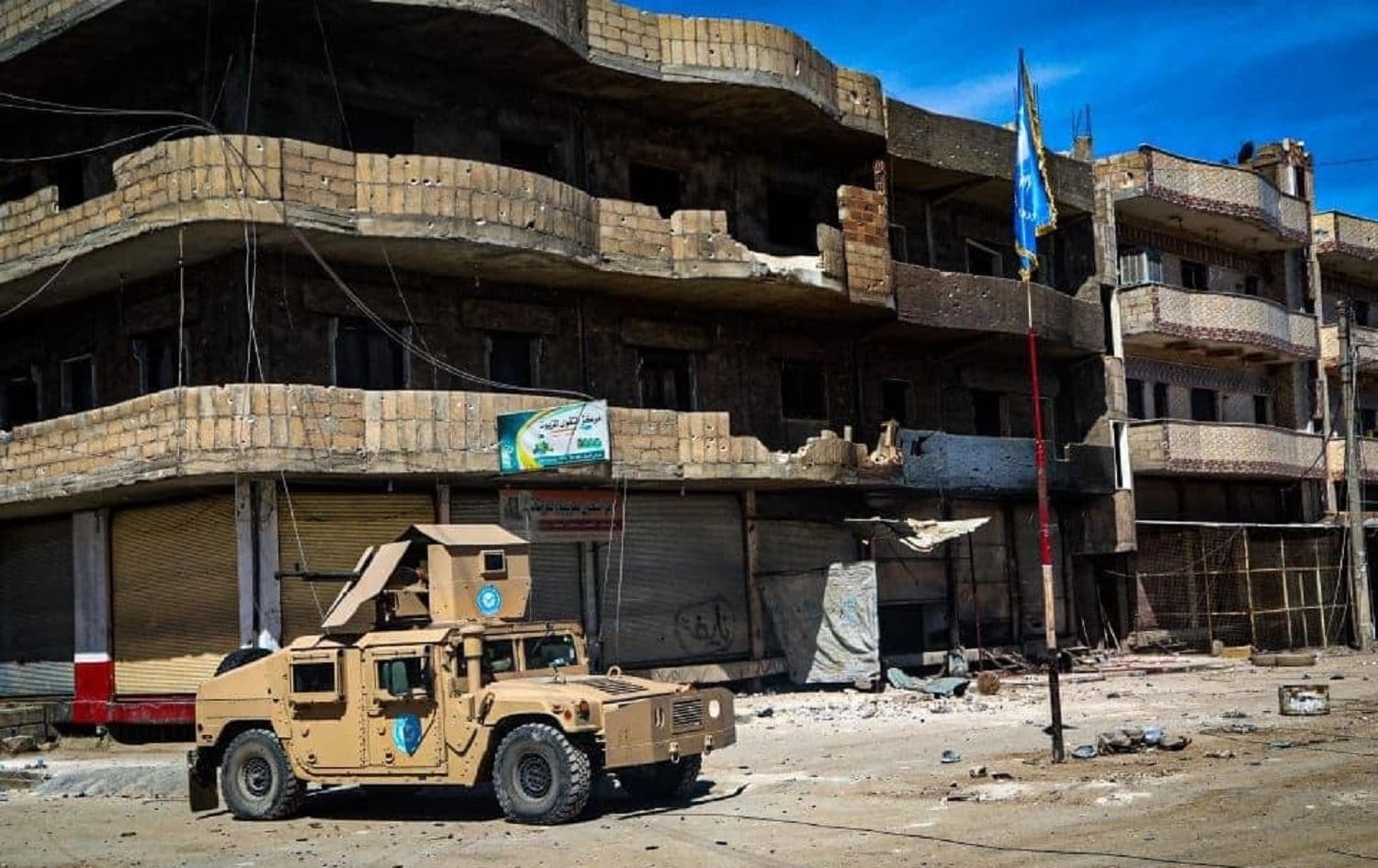 A vehicle and flag of the Kurdish security forces (Asayish) are seen in the al-Tai neighbourhood of Qamishli on April 24, 2021. Photo: handout/Asayish