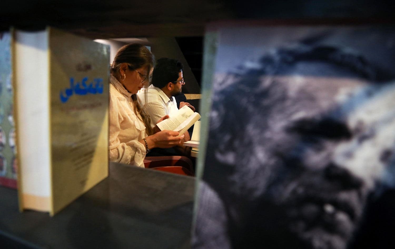 Members of a book club meet to review a novel at a book store in Erbil on April 9, 2021. Photo: Safin Hamed/ AFP