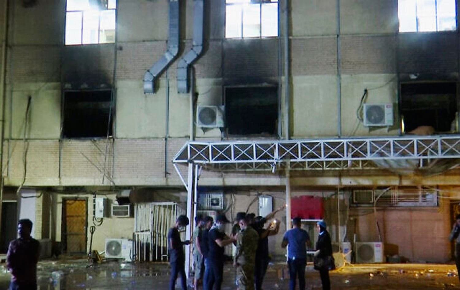  First responders work the scene of a fire at a hospital in Baghdad on April 24, 2021. Photo: AP