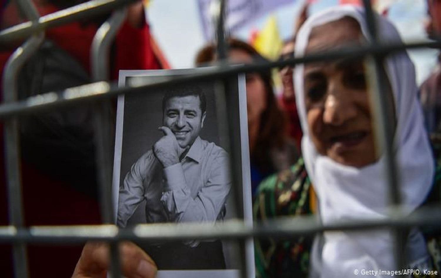 A woman holds a picture of former HDP co-chair Selahattin Demirtas. Photo: Ozan Kose/AFP