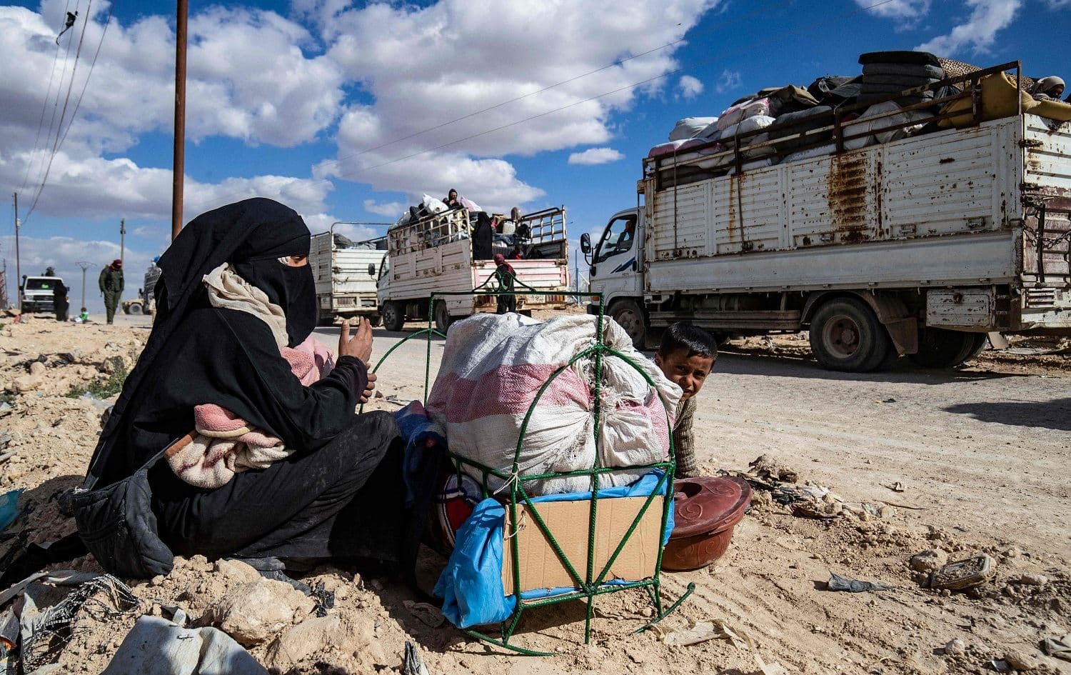 A woman and her children pictured in al-Hol camp, northeastern Syria on March 18, 2021. File photo: Delil Souleiman/AFP