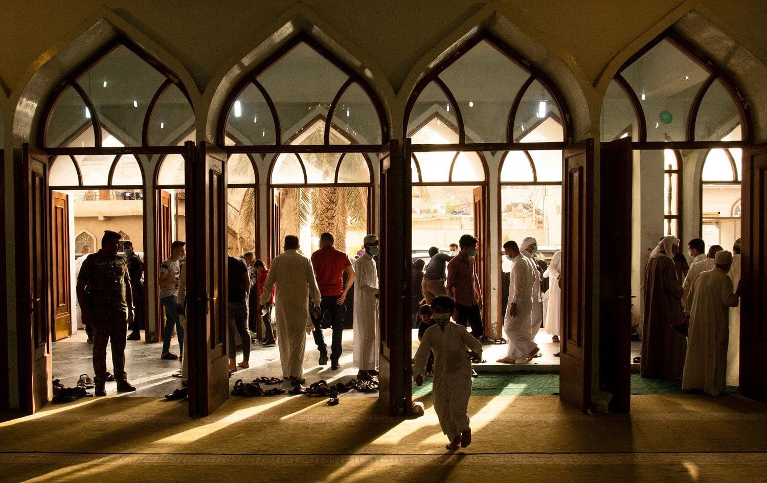 Muslims gather to perform the Eid Al-Fitr prayer marking the end of the holy month of Ramadan at the Grand Mosque in Basra on May 13, 2021. Photo: Hussein Faleh/AFP