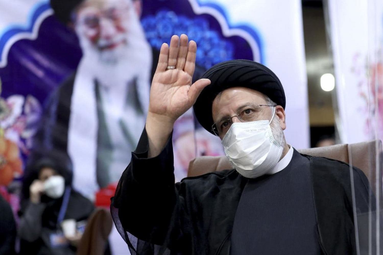 Ebrahim Raisi, head of Iran's judiciary waves to journalists while registering his candidacy for the upcoming presidential elections at the Interior Ministry in Tehran, Iran, Saturday, May 15, 2021. Photo: Ebrahim Noroozi/ AP