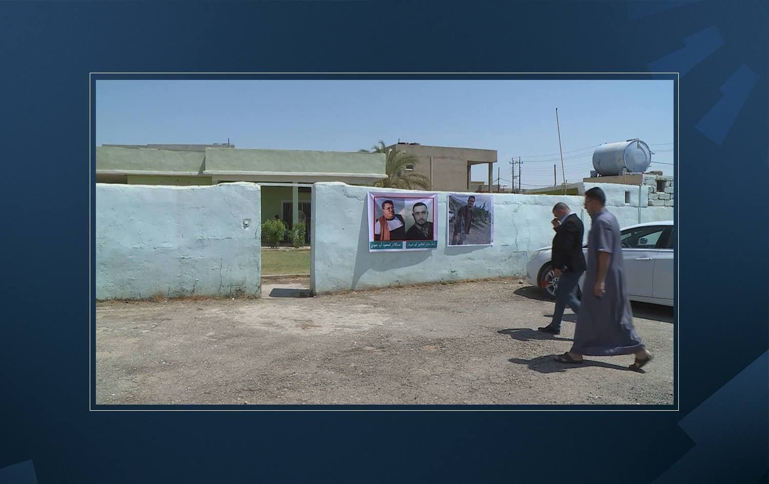 Images of three men abducted by ISIS are displayed outside a home in Makhmour on August 11, 2021. Photo: Rudaw
