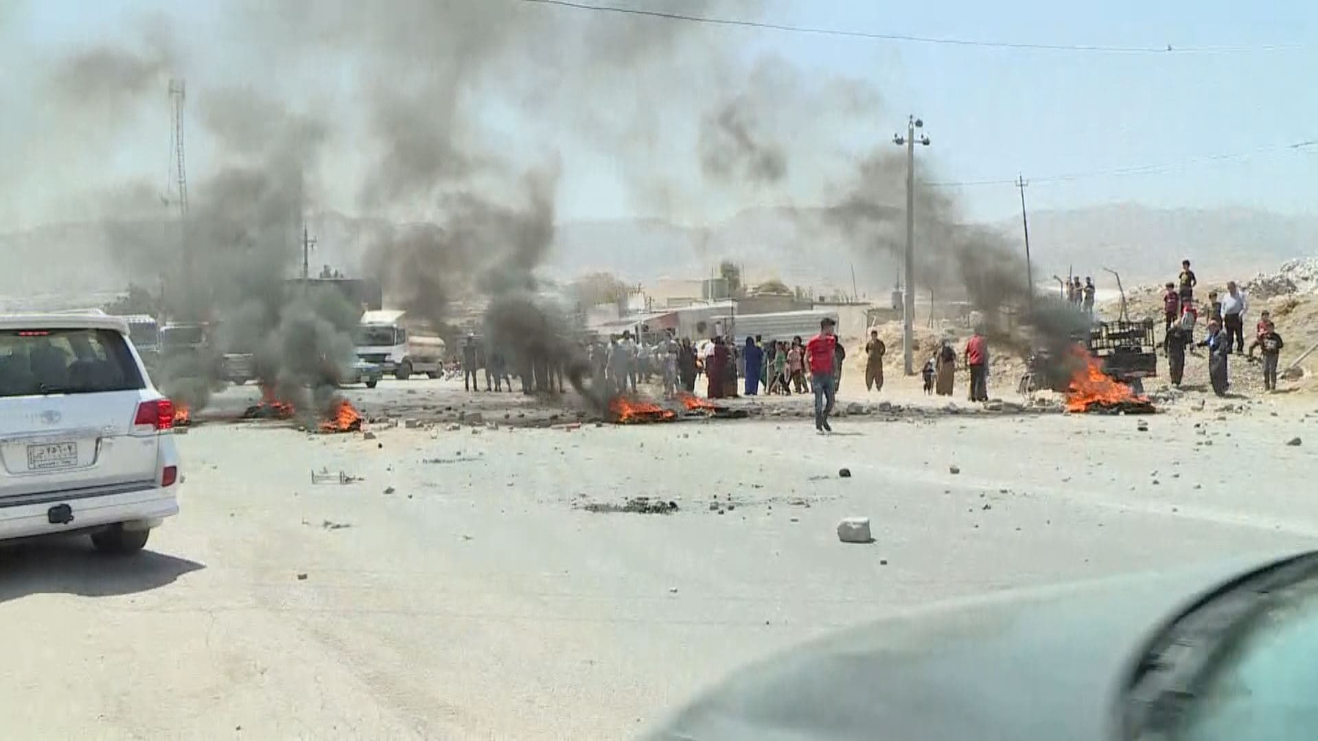 Residents of Sulaimani province's Tanjero area protest against the lack of drinking water and toxic industrial pollution, blocking off roads, August 15, 2021. Photo: Rudaw