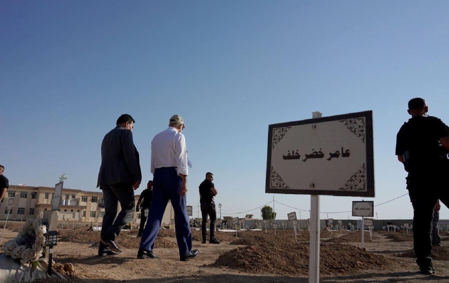 Iraqi Prime Minister Mustafa al-Kadhimi (in white) pays his respects to the Yazidi victims of ISIS in a visit to Kocho, Shingal area on August 16, 2021. Photo: handout/PM office