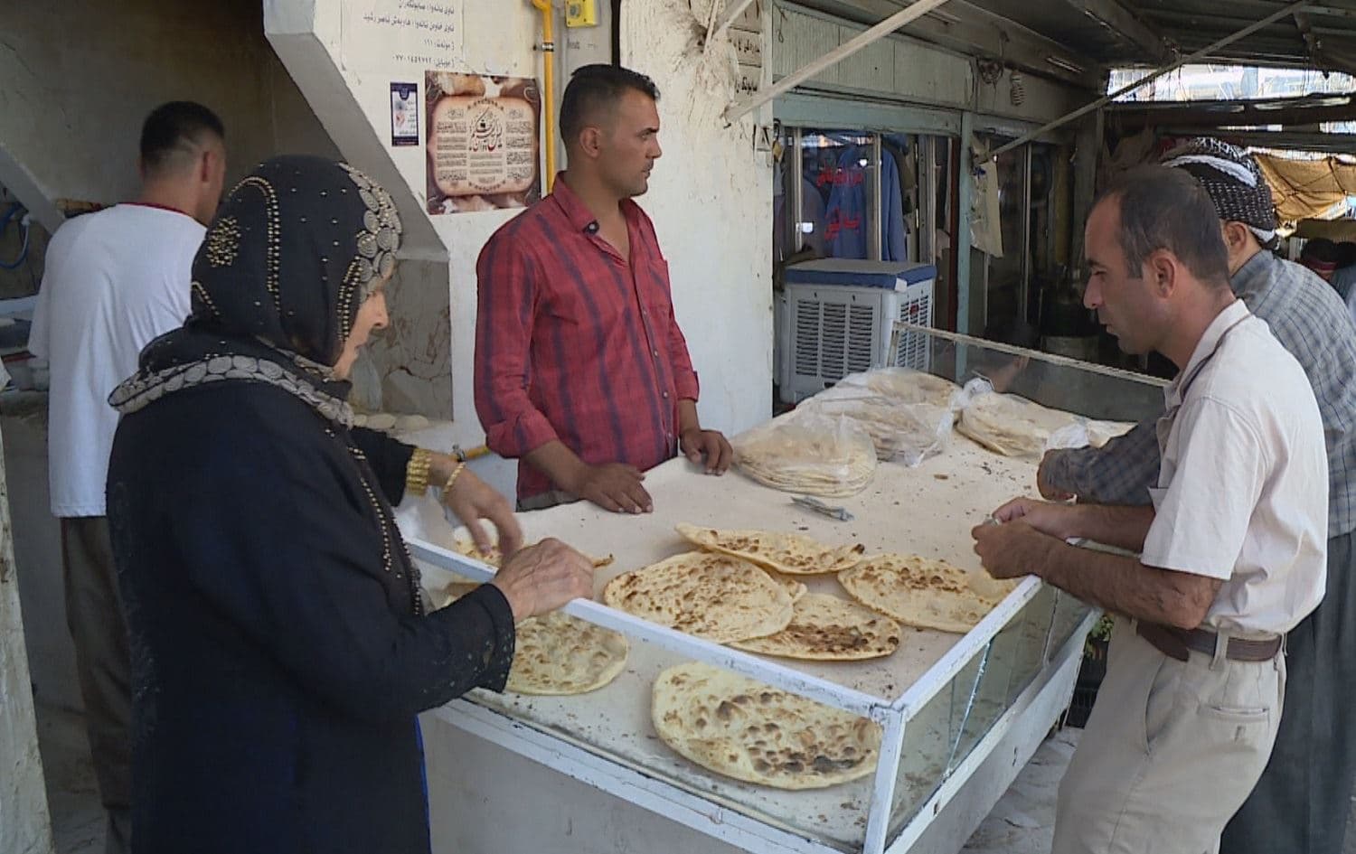Customers visit a bakery Sulaimani on August 21, 2021. Photo: Rudaw 
