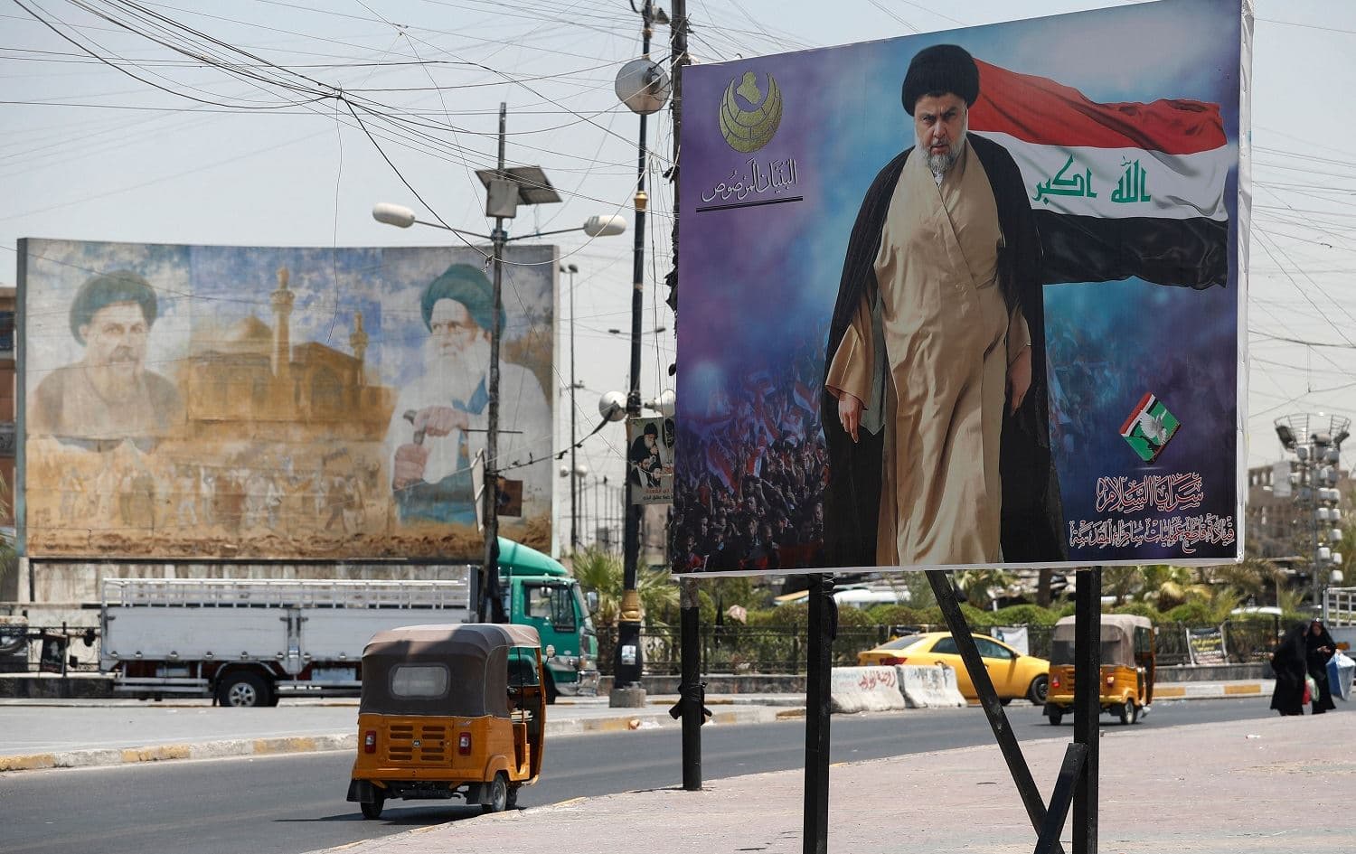 A poster of Shiite cleric Muqtada al-Sadr towers over a street in Sadr City, Baghdad on July 15, 2021. File photo: Ahmad al-Rubaye/AFP