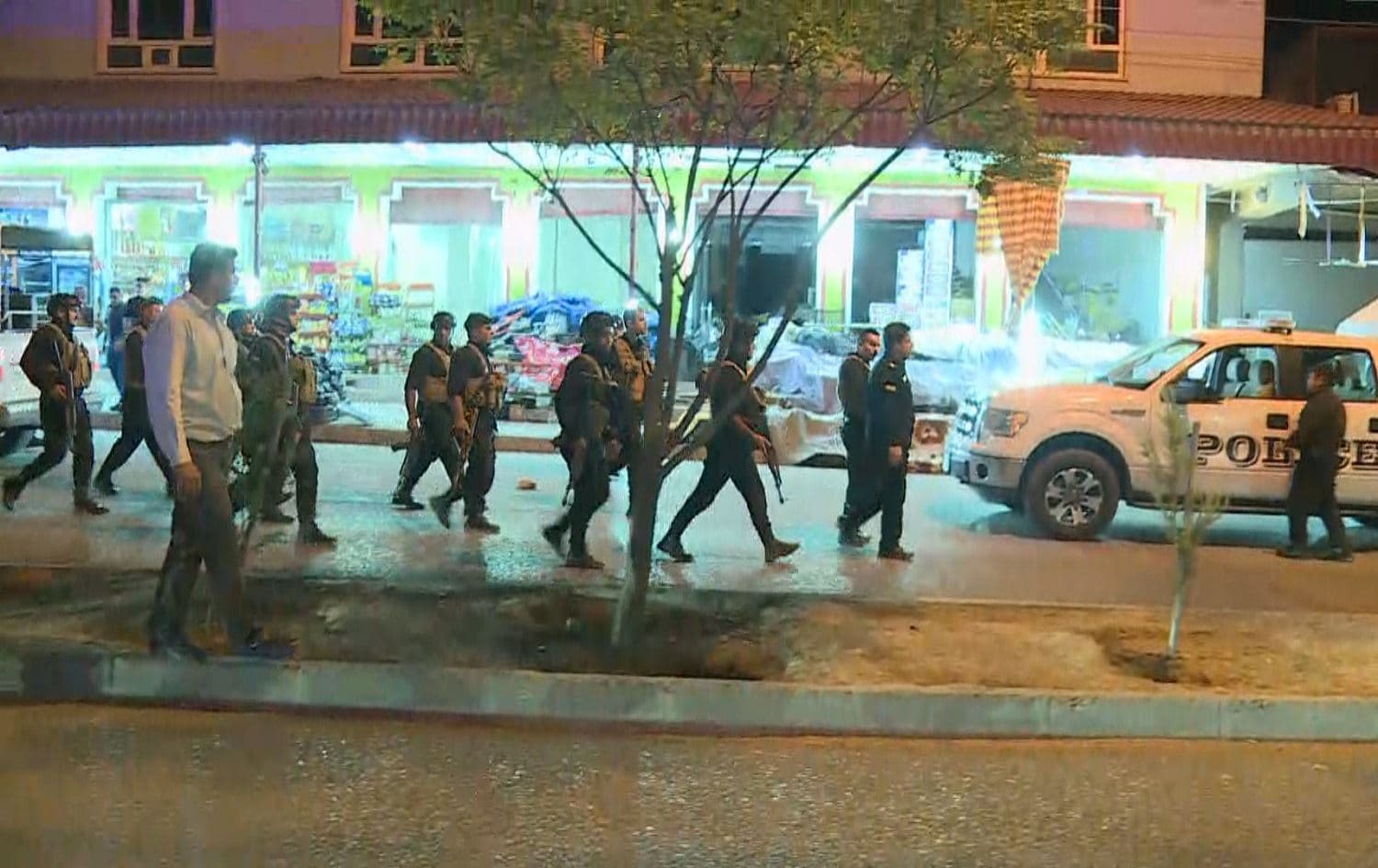 Security forces walk through Harir where a family feud left three dead on September 30, 2021. Photo: Rudaw