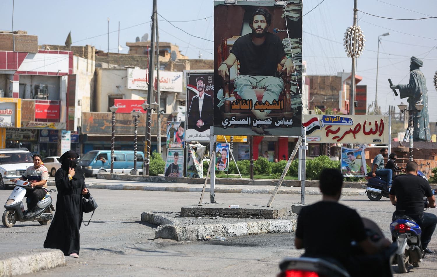 Iraqis go about their day at al-Haboubi Square in the southern city of Nasiriyah, on September 1, 2021. Ahmad Al-Rubaye/ AFP