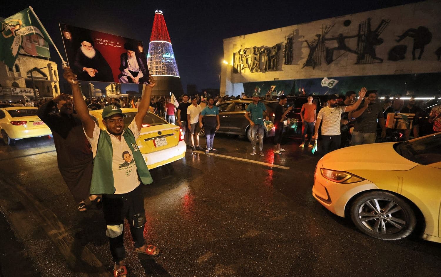 Supporters of Iraqi Shiite cleric Muqtada al-Sadr celebrate in Baghdad's Tahrir square on October 11, 2021. Photo: Ahmad al-Rubaye/AFP