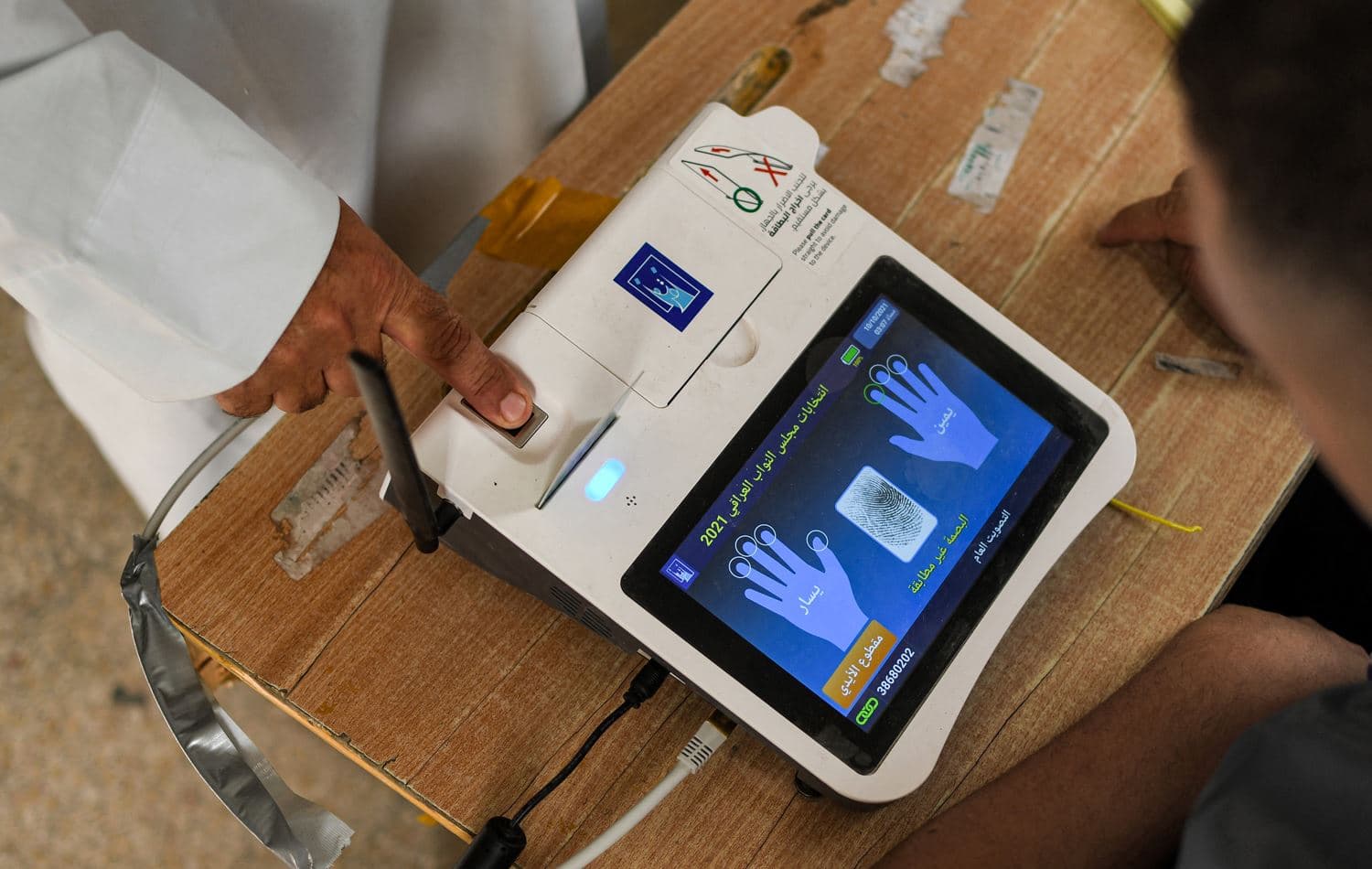 A voter scanning his fingerprint while registering his vote during the Iraqi parliament elections on October 10. Photo: AFP
