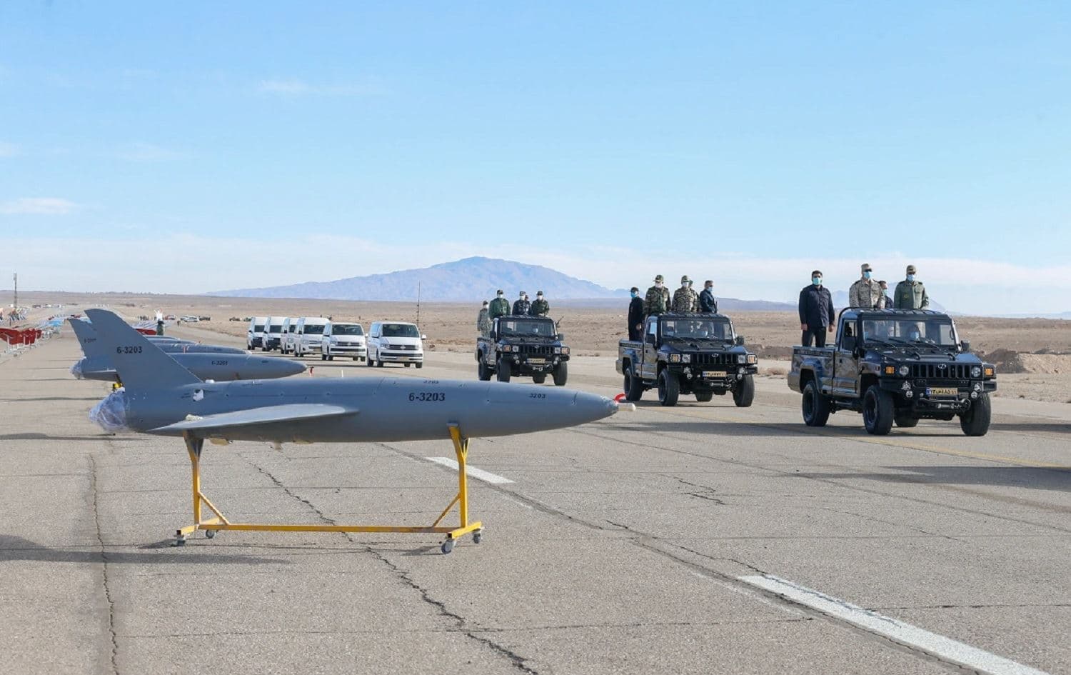 Senior Iranian military commanders inspect drones as they are prepared for a large-scale drone combat exercise in Semnan, Iran on January 4, 2021. Photo: handout/Iranian army