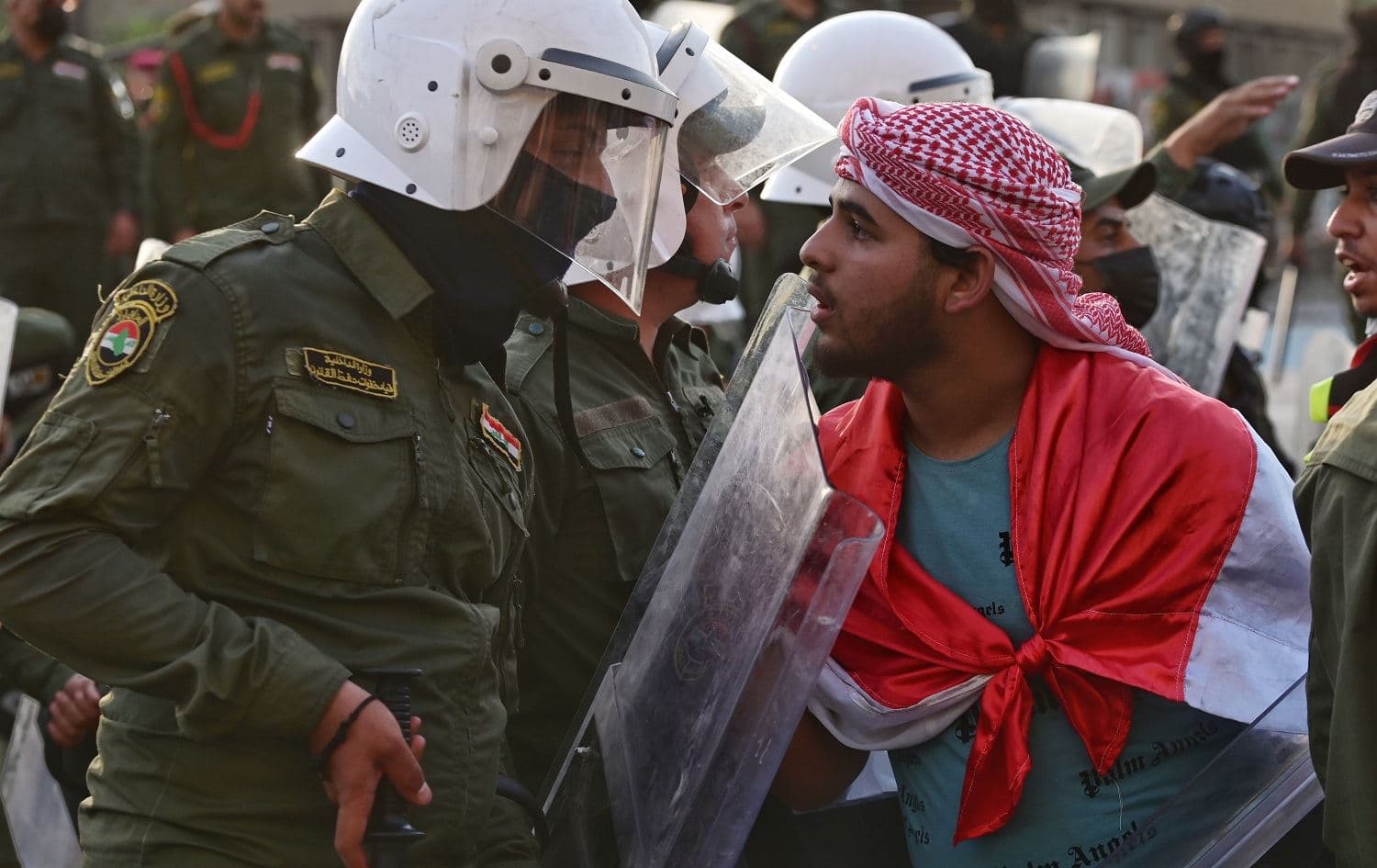 A protestor confronts security forces at a demonstration in Baghdad on May 25, 2021 condemning impunity in the deaths of protestors. File photo: Bilind T. Abdullah/Rudaw
