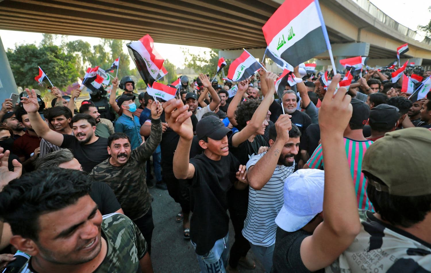 Pro-Tehran militia supporters protest against last month’s election results at the Green Zone in Baghdad. November 5, 2021. Photo: AFP