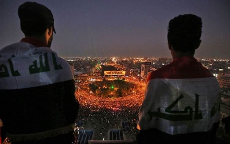 Iraqi protestors look over anti-government demonstrations in Baghdad’s Tahrir Sqaure on October 31, 2019. Photo: AFP 