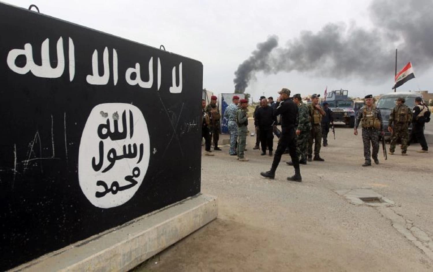 Bullet holes shown on an Islamic State (ISIS) mural. File Photo: AFP