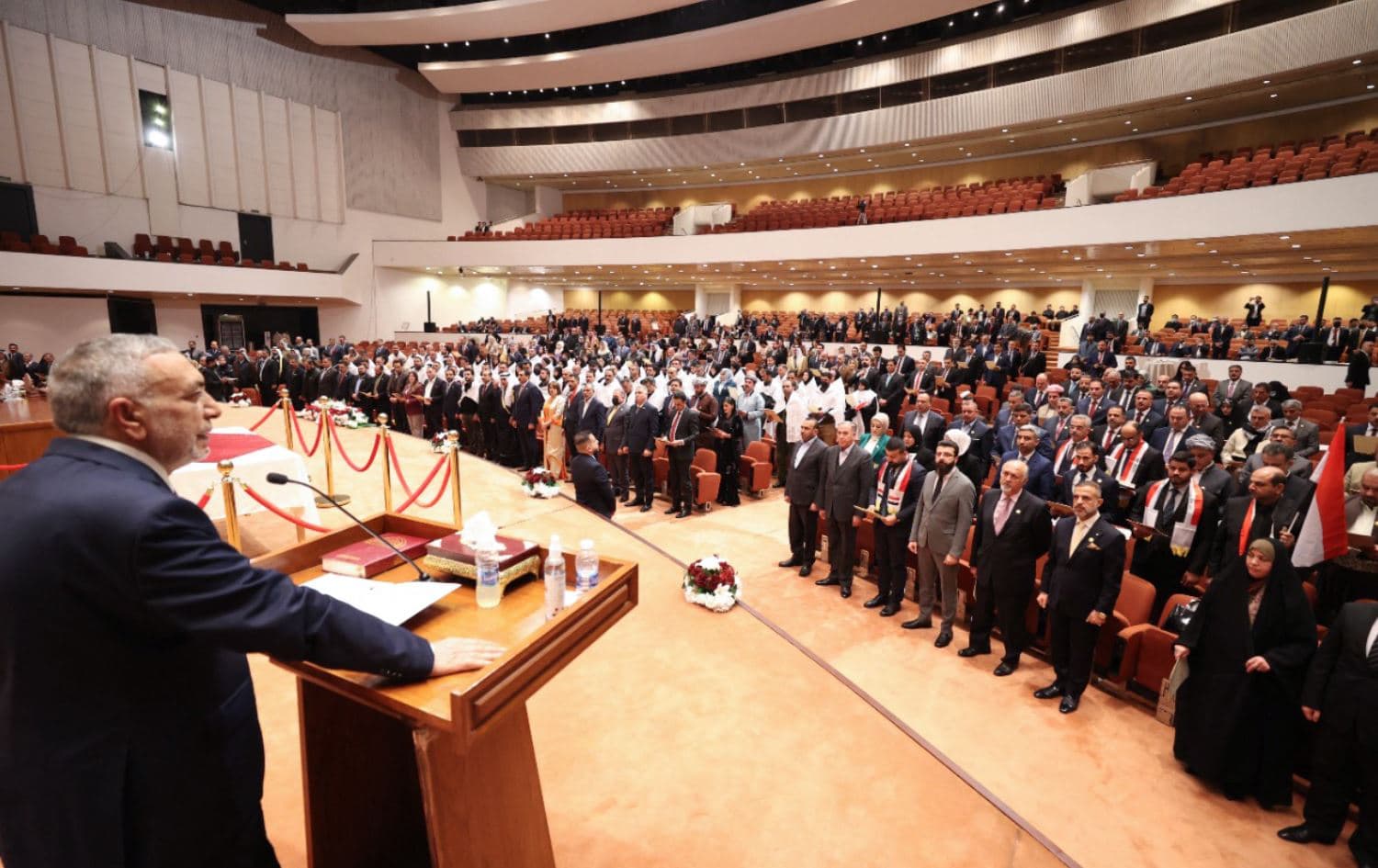 A handout picture released by Iraq's Prime Minister's Media Office showing Mustafa al-Kadhimi (left) addressing Iraqi lawmakers attending the inaugural session of the new parliament in Baghdad, on January 9, 2022. Photo: Iraqi Prime Minister's Press Office / AFP