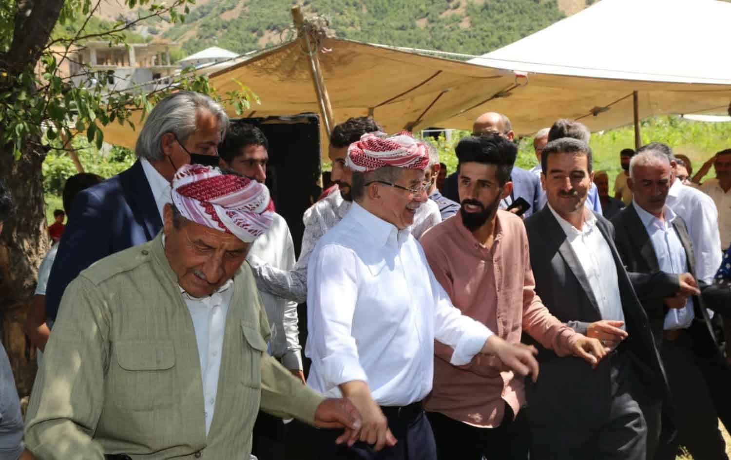 Ahmet Davutoglu (second from left) performs Kurdish traditional dance with Kurdish people in Semdinli province, Turkey on August 26, 2021. Photo: handout/Davutoglu 