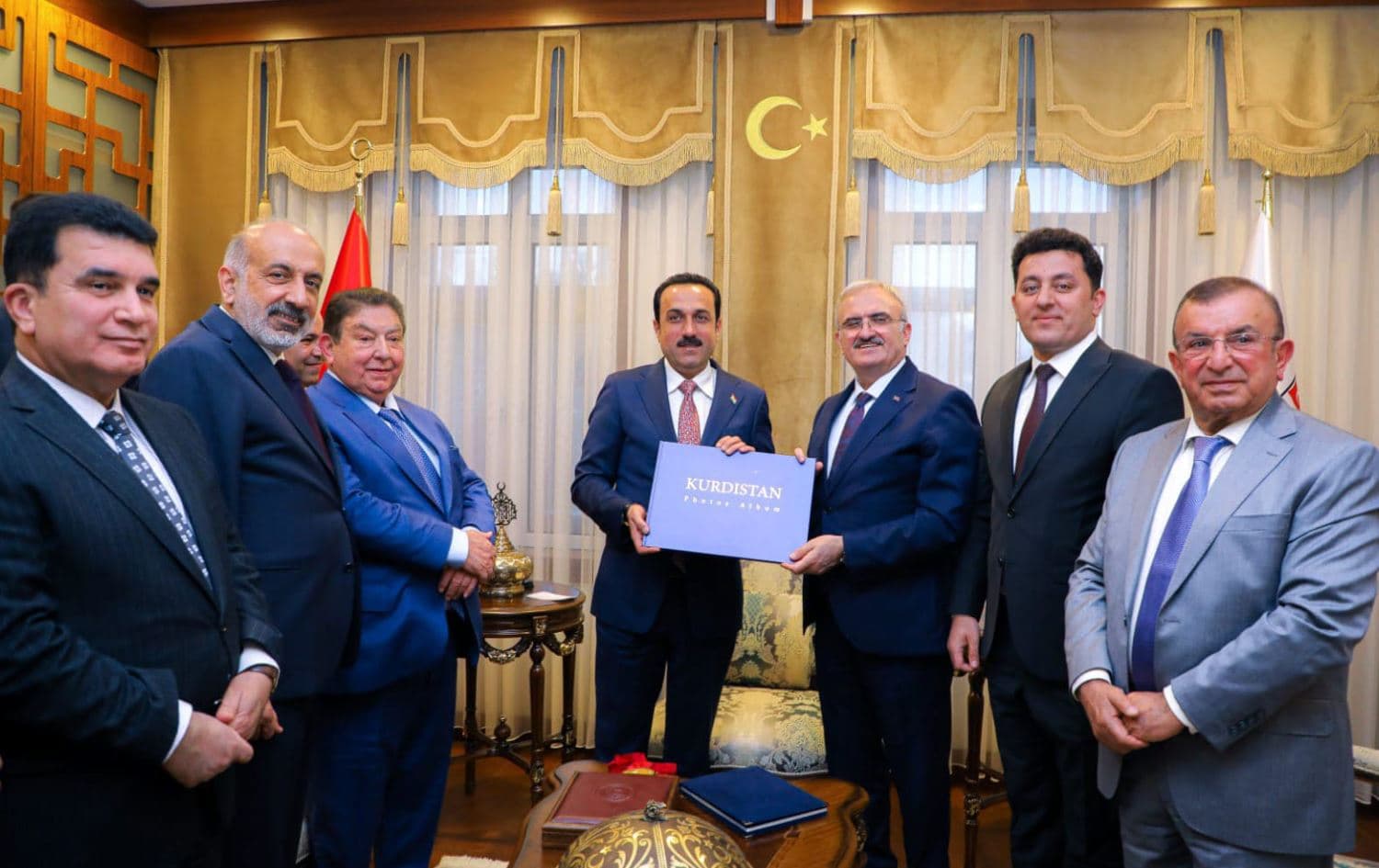 Erbil Governor Omed Khoshnaw (4th from left) presents Kurdistan Photo Album to Diyarbakir Governor Munir Karaloglu (3rd from right) in Diyarbakir, Turkey on March 24, 2022. Photo: handout